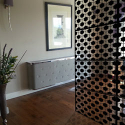 black-geodots-laser-cut-metal-screen-in-piano-room-with-shadow